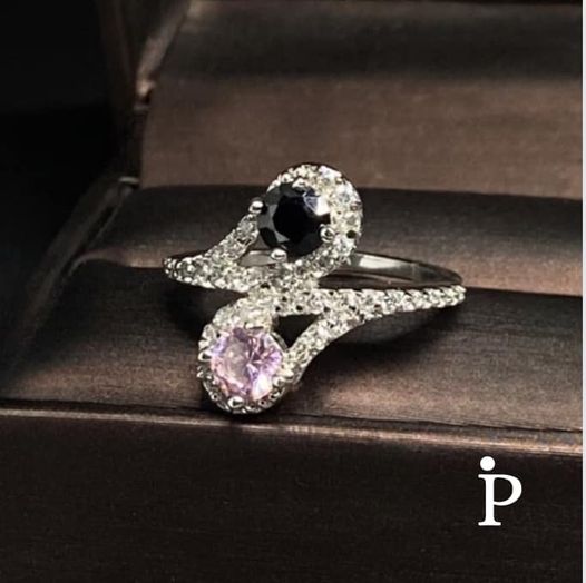 (ULP-27).925 Silver ring with a pink zirconia, another with a black onyx