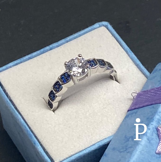 Anillo De Plata De Ley De Compromiso Con Circonita Cúbica Blanca y Azules - JoyeriaParis