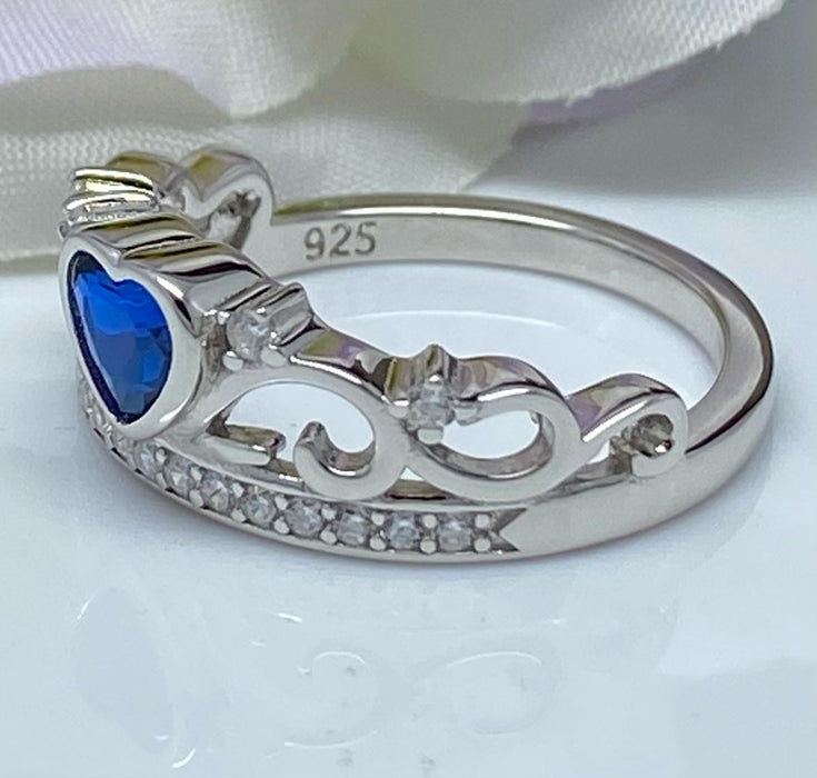 (AE-81) .925 Silver crown-shaped ring with sapphire blue zirconia.