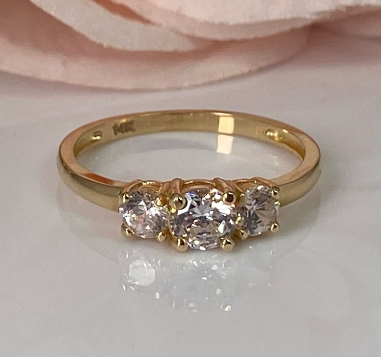 (ACO-09) 14K yellow gold engagement ring with three Zirconia.